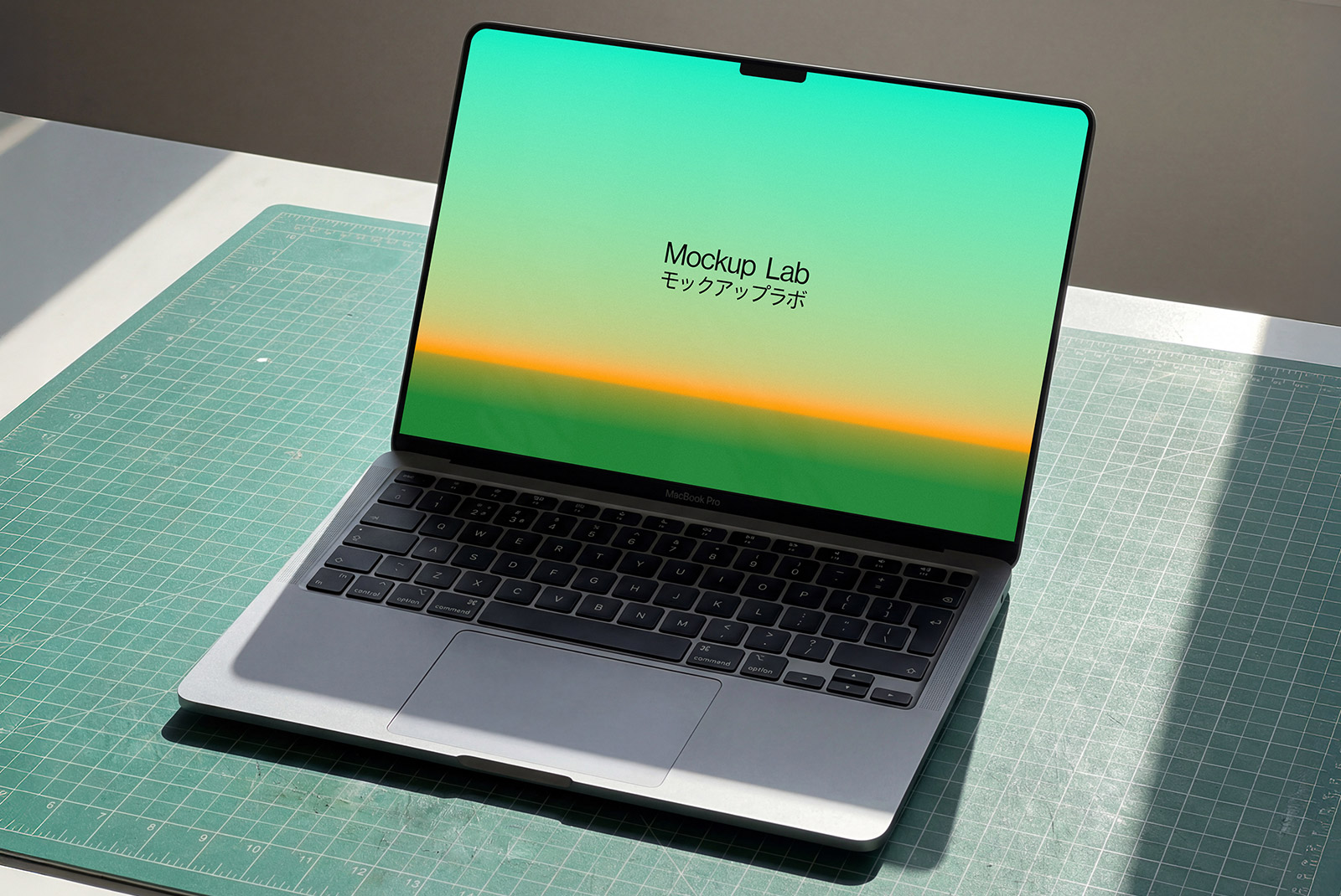 Close-up view of a MacBook 01ML mockup displaying a website design on its screen.